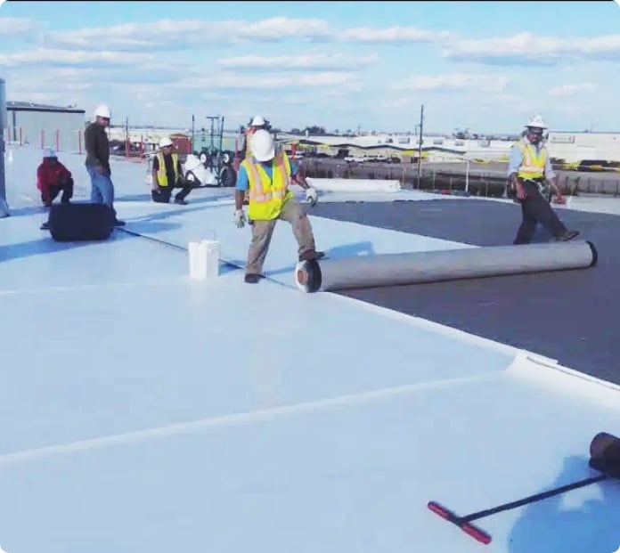Men Working On A Commercial Roof
